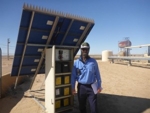 Santos technician in the desert with solar panel